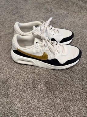 Nike Cream and Black Sneakers with Gold Swoosh